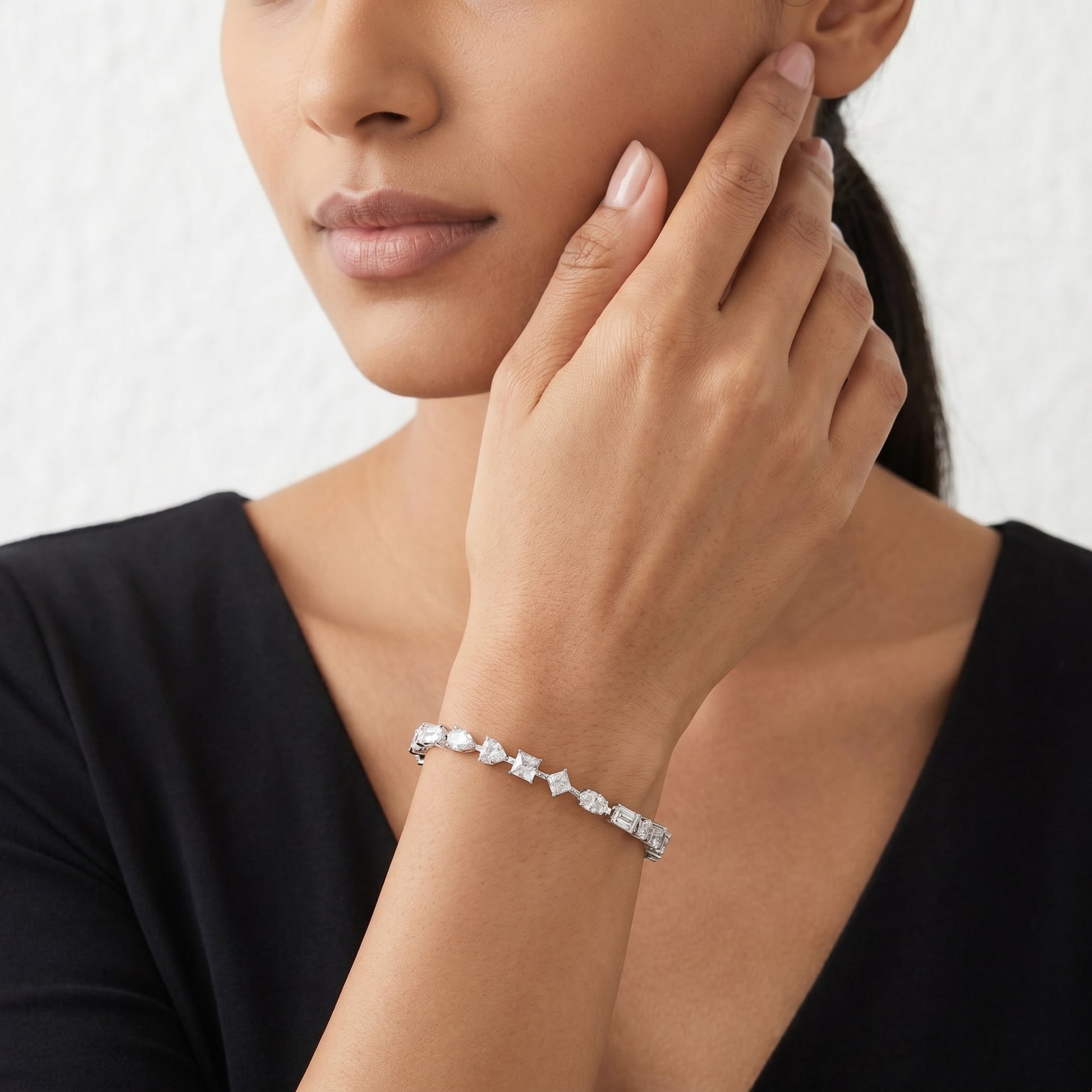 Close-up of a sparkling 10.8g heavy-weight moissanite cluster bracelet worn by a model in a luxury lifestyle setting.
