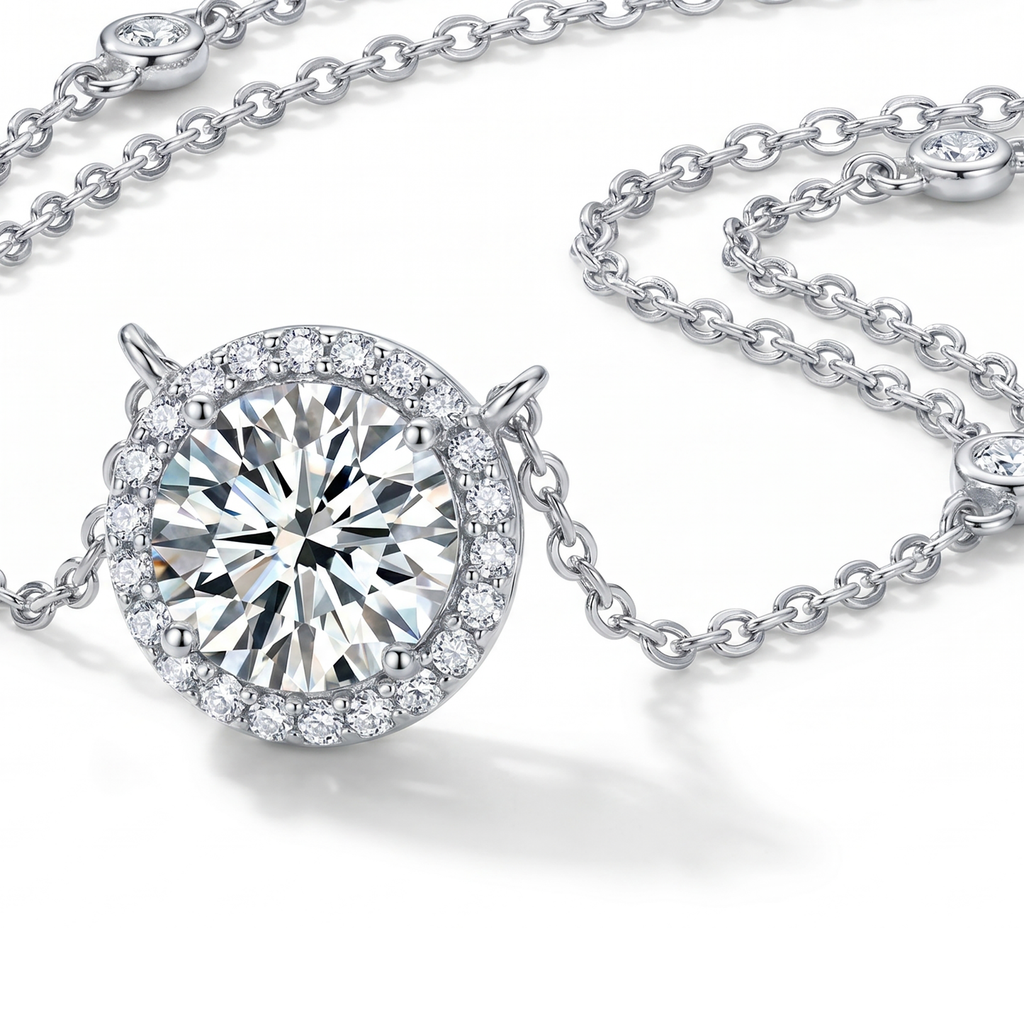 Close-up product shot of round halo moissanite pendant necklace and silver chain