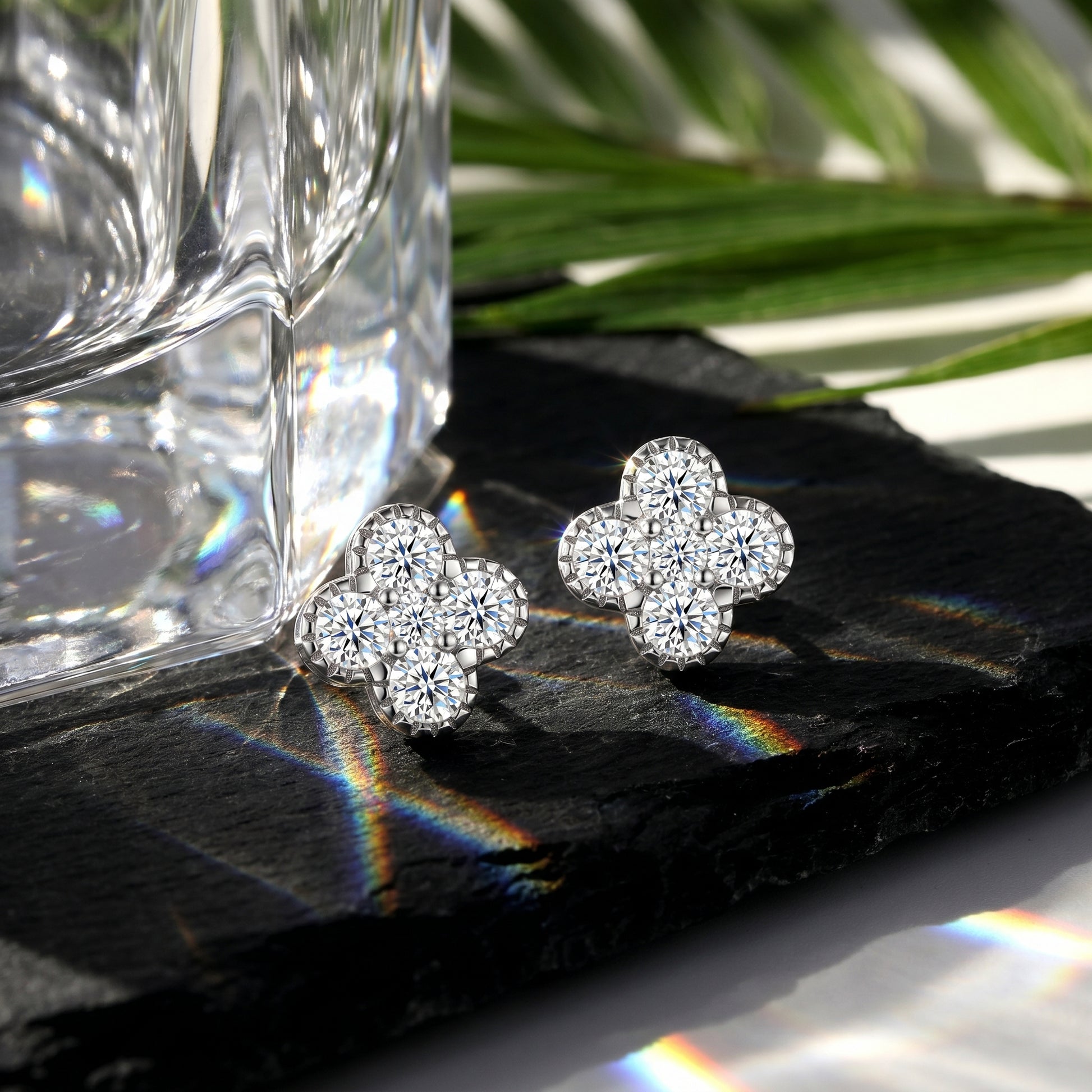 Four-flower cluster moissanite stud earrings with prism light reflections