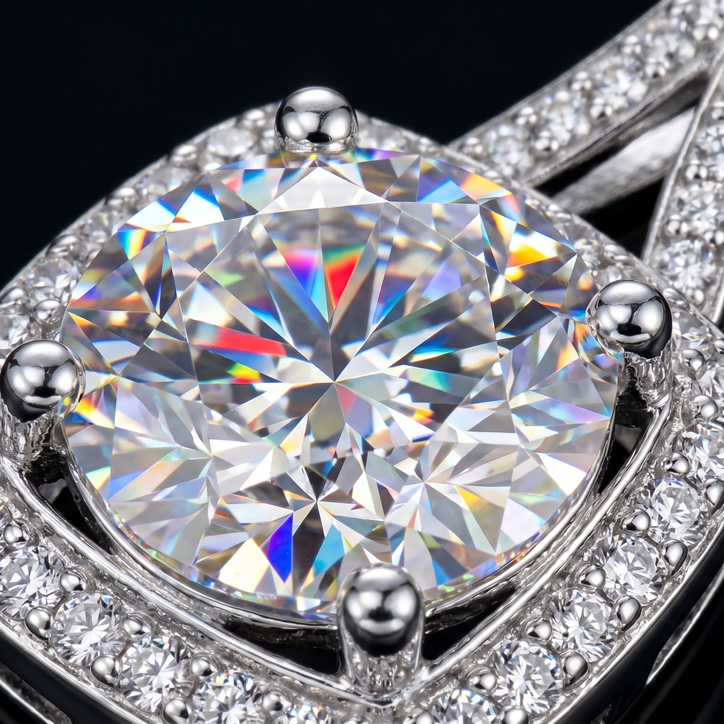 Macro close-up of cushion halo moissanite pendant showing brilliant fire and pavé details