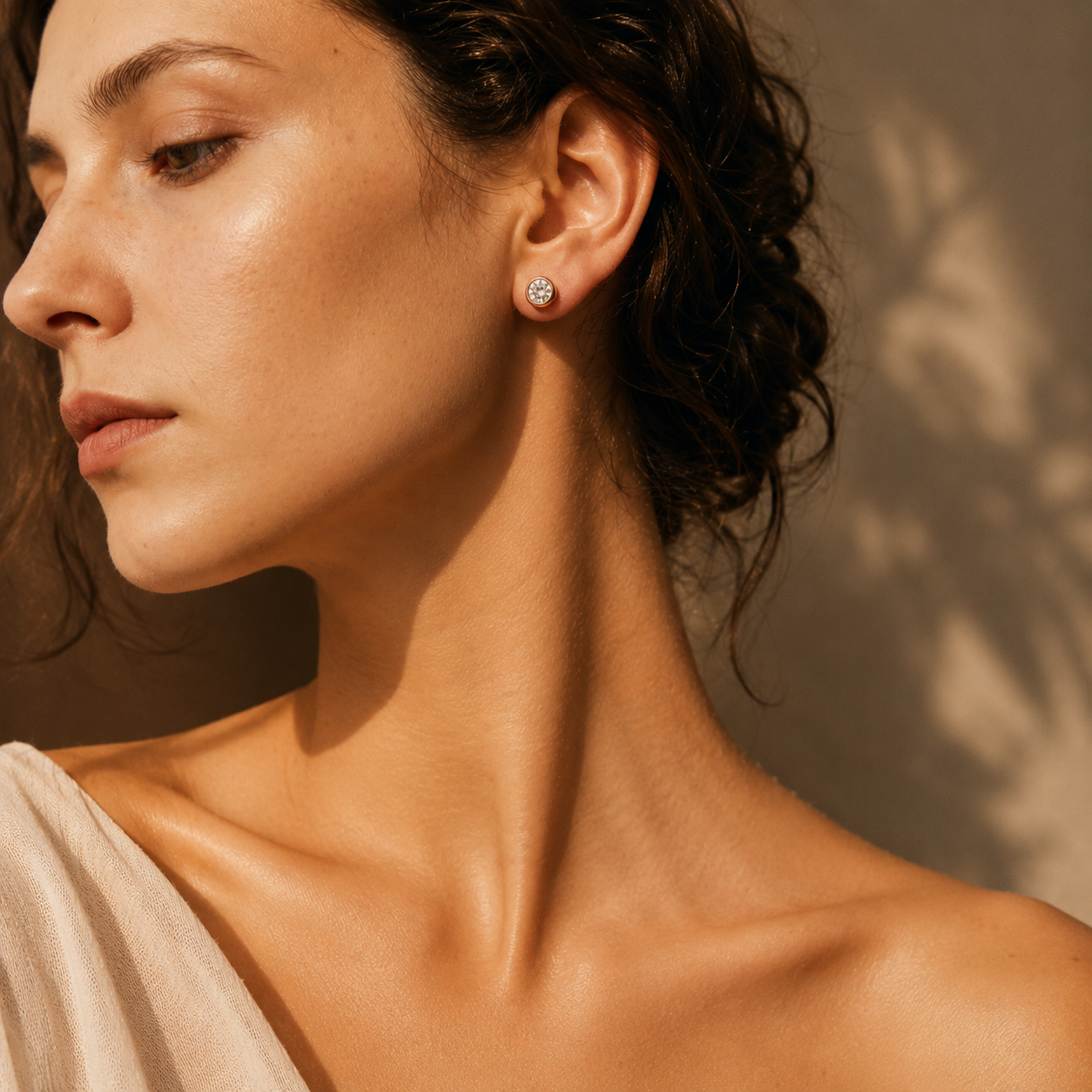 Elegantly styled Moissanite stud earrings for daily wear on wheat skin model