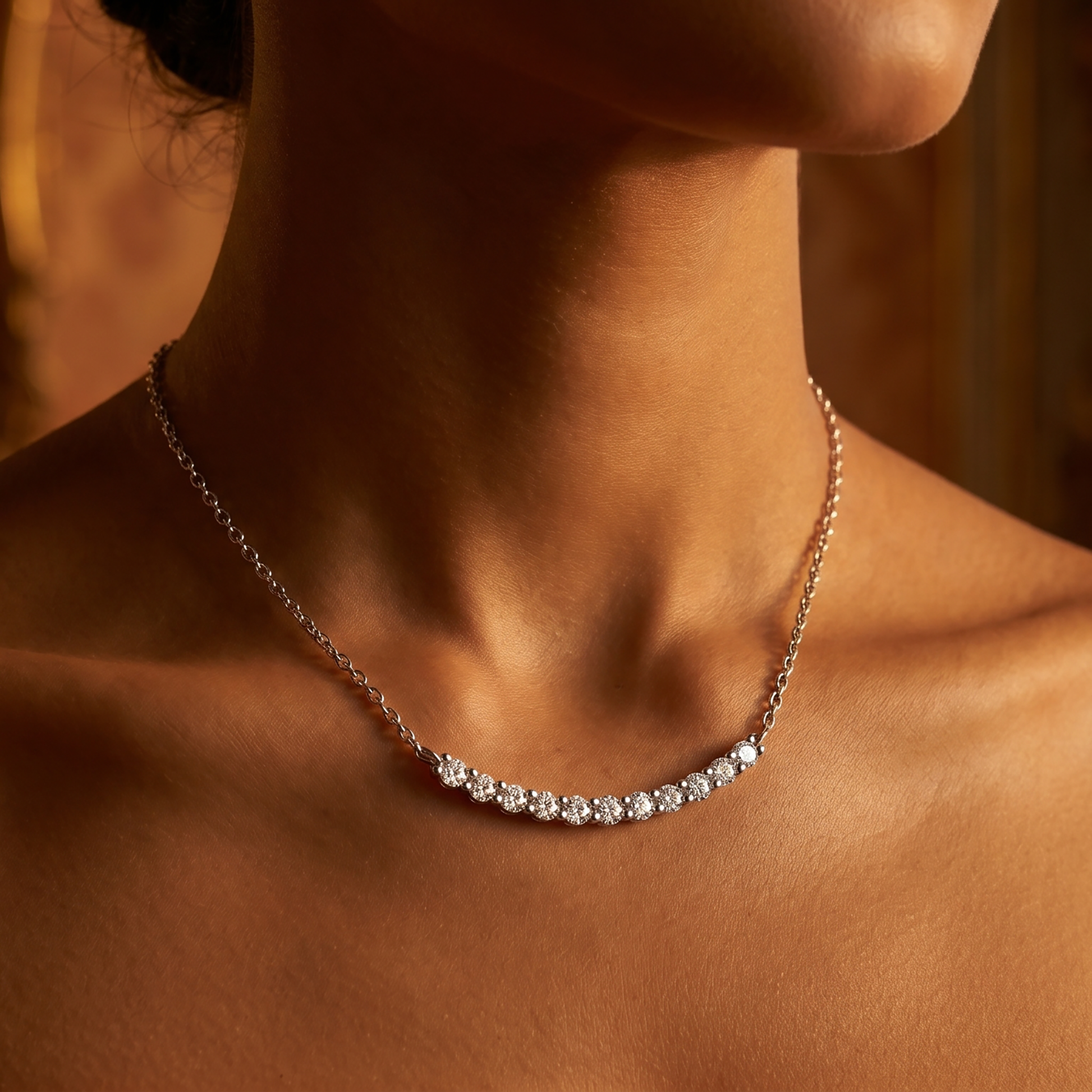 Woman wearing a silver curved moissanite bar necklace in warm evening light