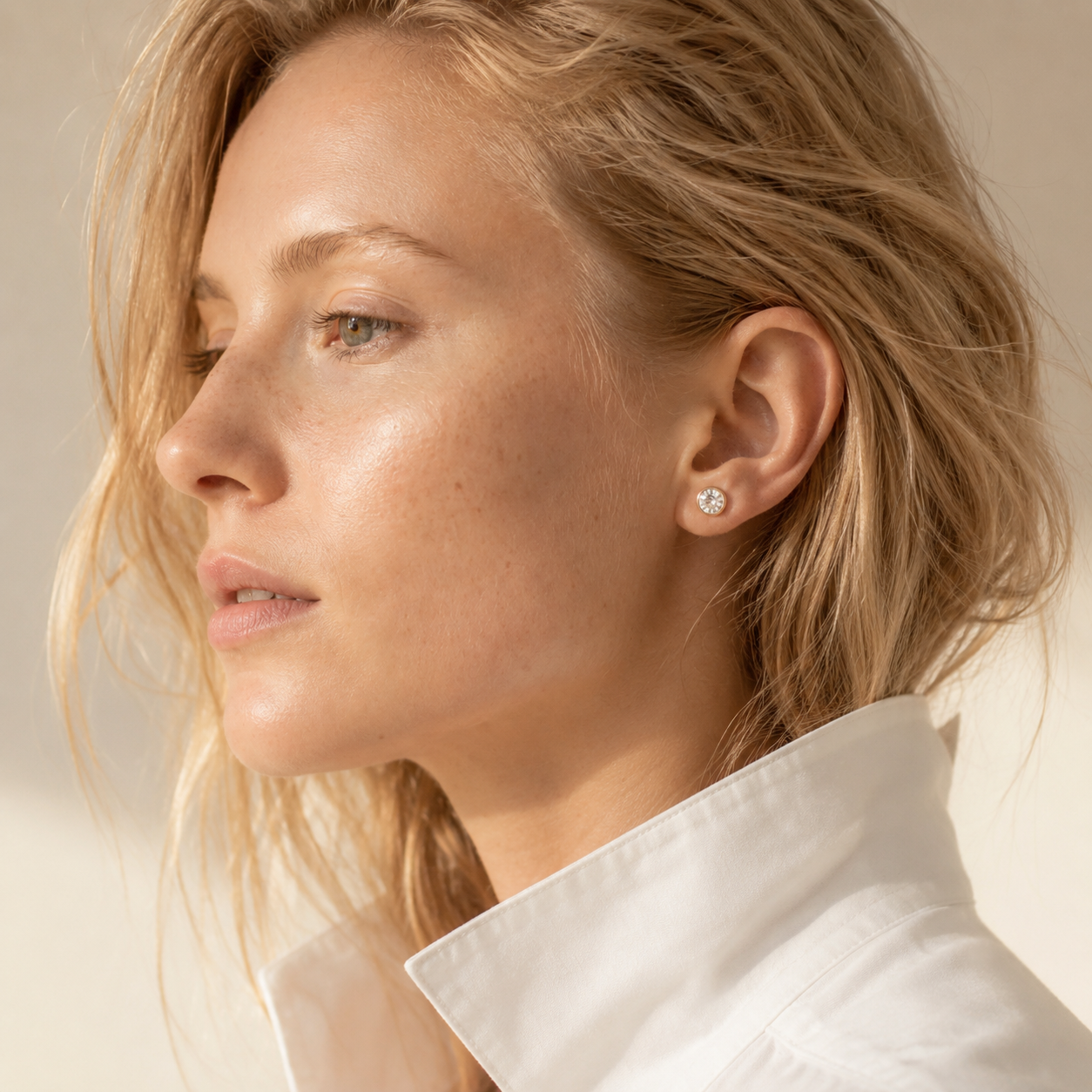 Elegantly styled Moissanite stud earrings for daily wear on wheat skin model
