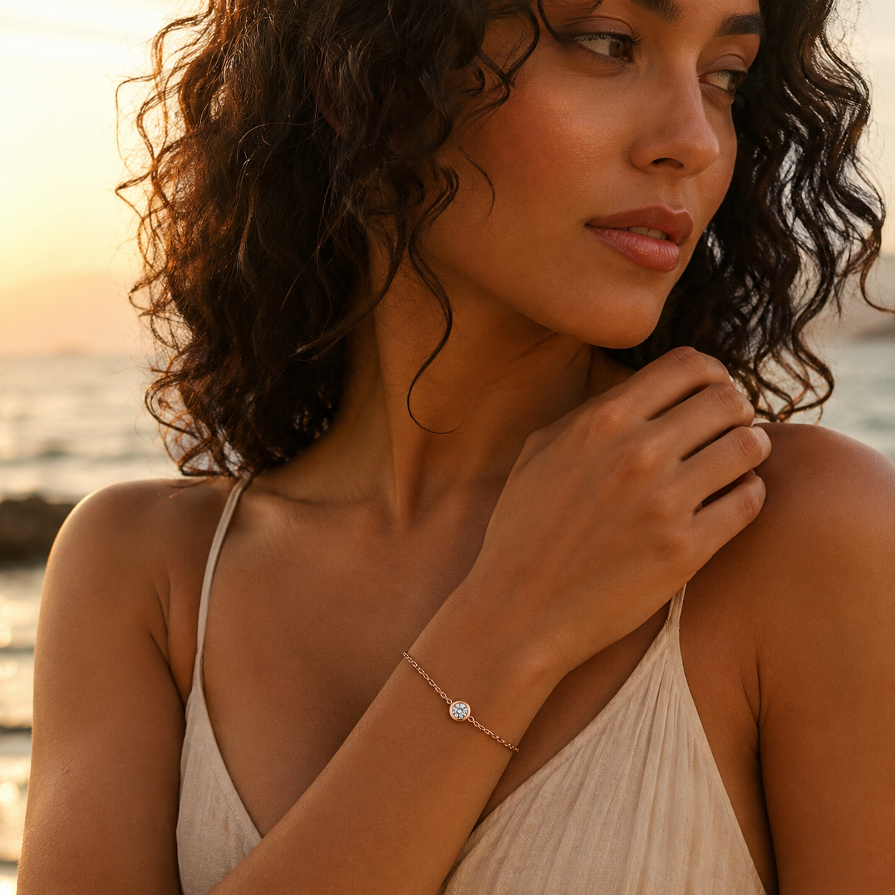 Woman wearing a minimalist moissanite bracelet with a quiet luxury look