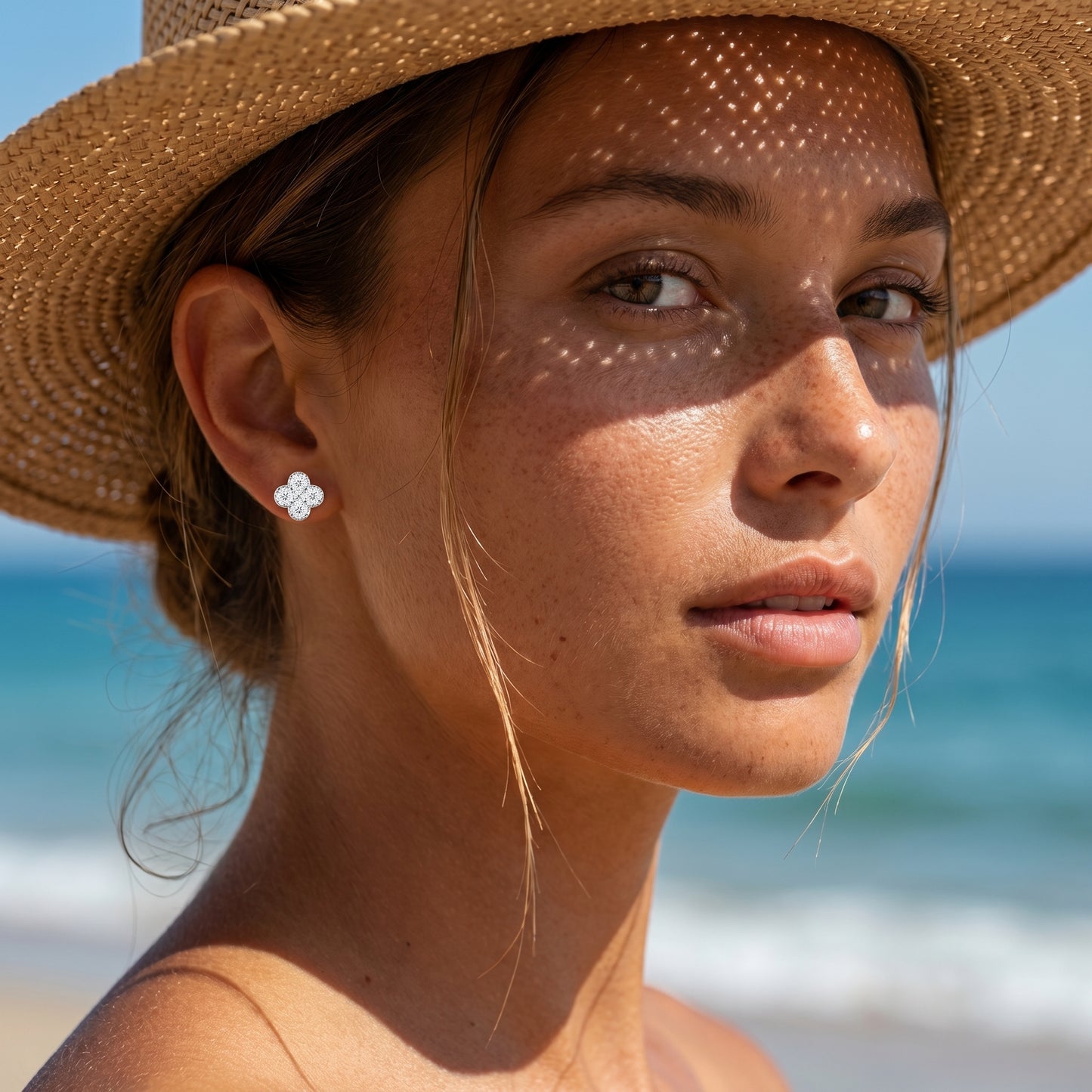 Beach lifestyle portrait with four-flower moissanite stud earrings