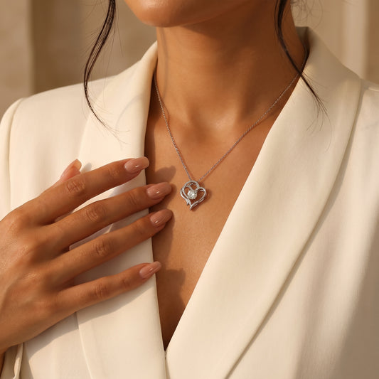 Elegant on-neck look of Luvia romantic heart-shaped moissanite necklace worn by a model in a modern luxury setting.