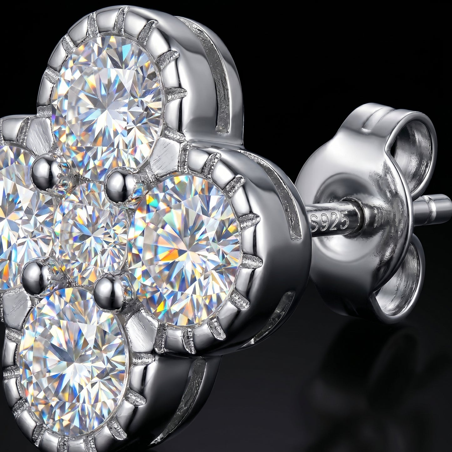 Macro close-up of sterling silver flower moissanite stud earrings showing sparkle and setting details