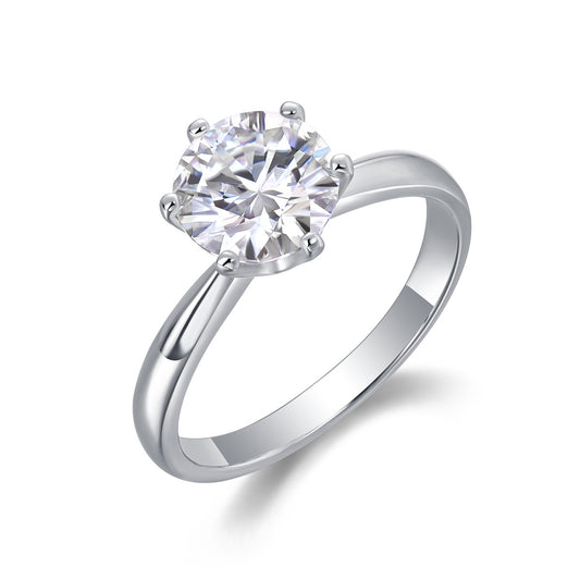 Luvia Jewelers round brilliant moissanite solitaire ring in sterling silver six-prong setting on white background