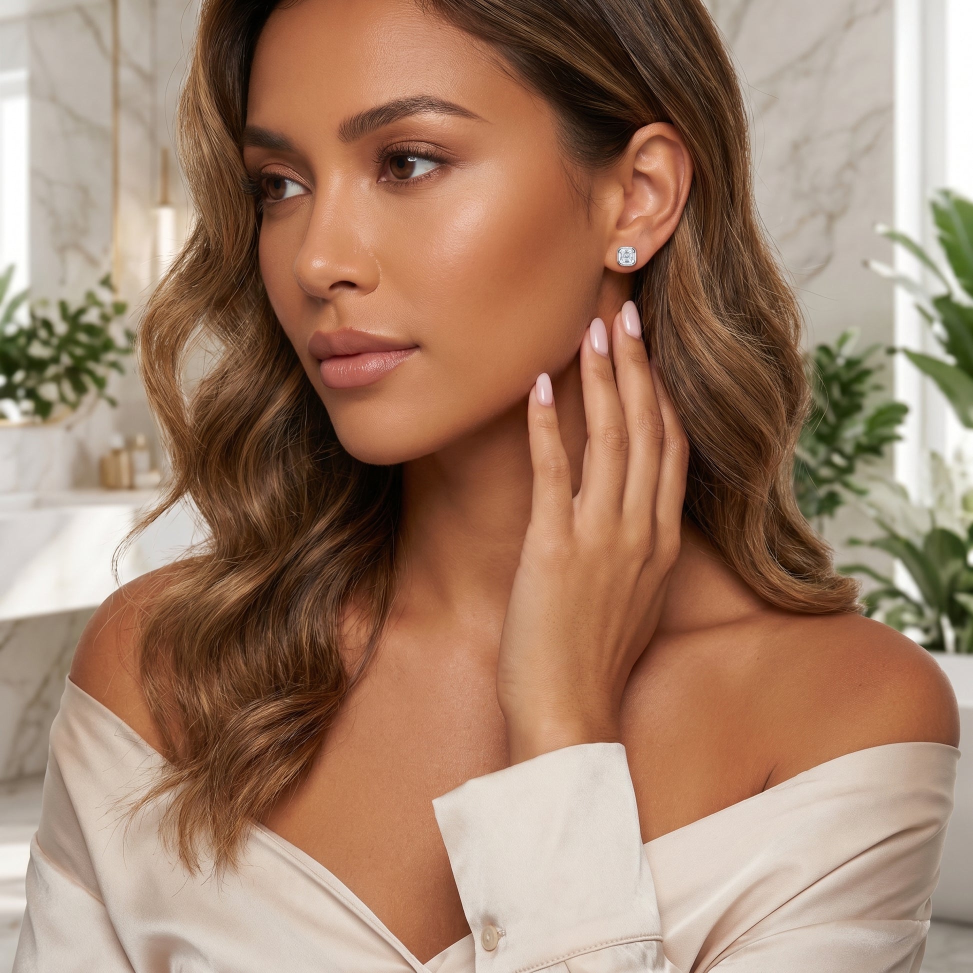 Sleek on-ear lifestyle look of Luvia vintage geometric Asscher moissanite stud earrings displayed on a tanned skin tone model.