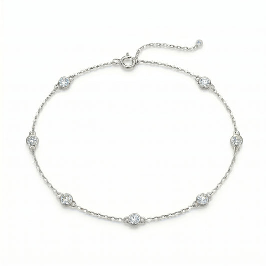 Luvia Jewelers seven-stone moissanite station bracelet in solid 925 sterling silver with adjustable chain.